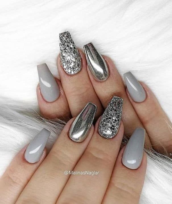 Sophisticated Gray-Toned Nail Design with Metallic Finishes and Shimmering Glitter for a Modern Look.