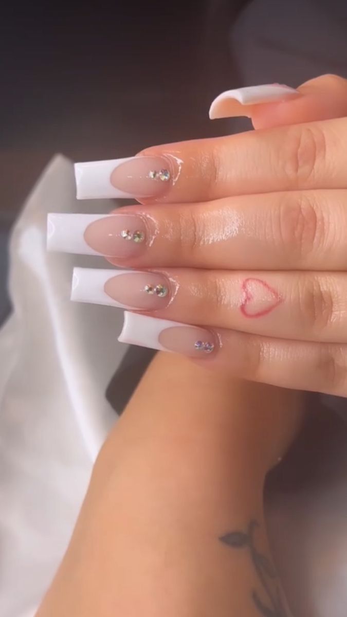 Chic Gradient Nail Design with Rhinestones and Heart Accents.