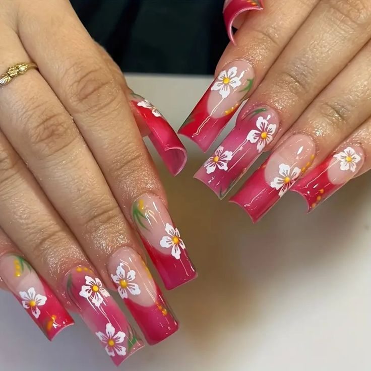 Chic Bold Floral Nails: Vibrant Pink Gradient with Elegant White Flowers and Fresh Green Accents.