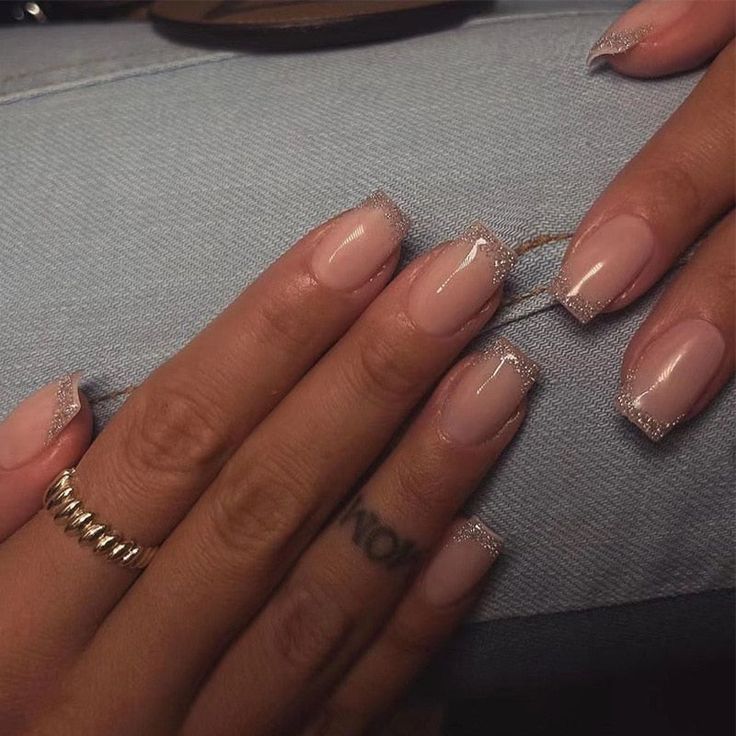 Sophisticated Nail Design: Classic Nude Base with Shimmering Silver Tips and Elegant Accent Ring