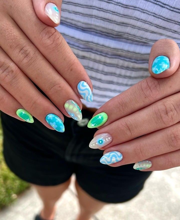 Vibrant Blue and Green Nail Art: Playful Swirls and Chic Finishes for a Fresh Summer Look.