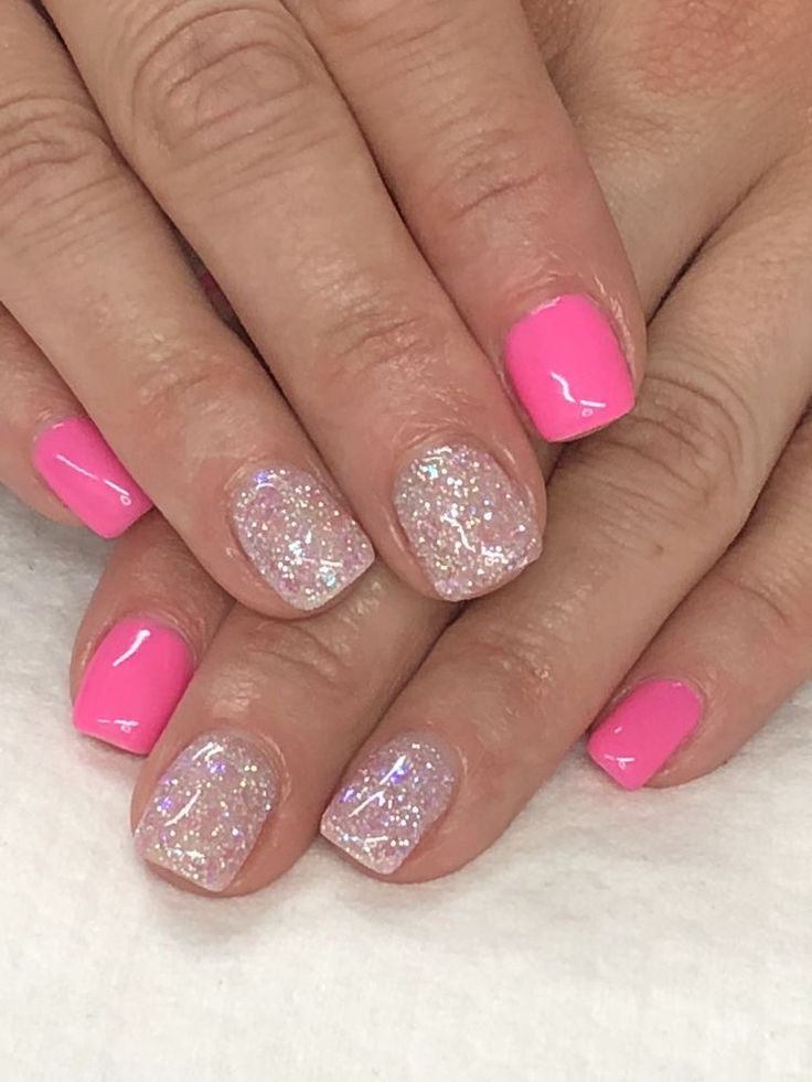 Playful Pink and Sparkling Glitter Manicure: A Bold Statement in Nail Art.