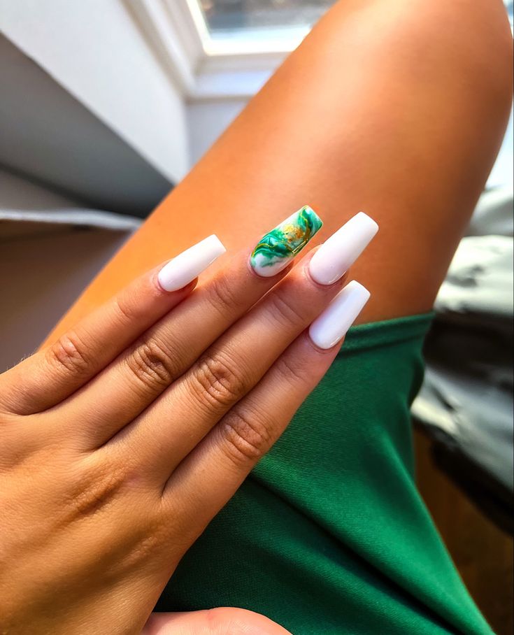 Chic Nail Design: Sleek White Nails with Vibrant Marbled Accent.