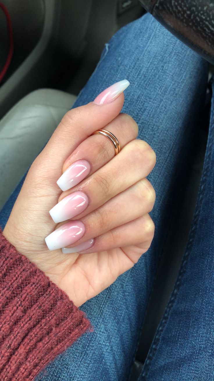 Timeless French Manicure with Soft Pink Base, White Tips, and Chic Gold Accessories.