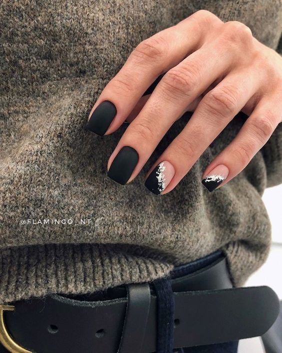 Chic Matte Black Nails with Glamorous Glitter Accent for a Bold Look.