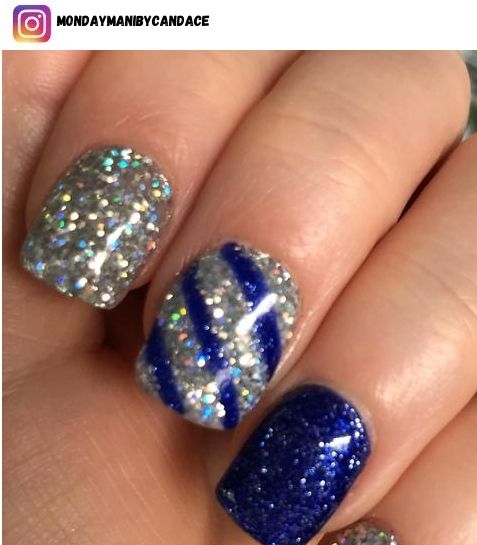 Elegant Glittering Nail Art with Silver and Deep Blue Hues and Holographic Sparkle