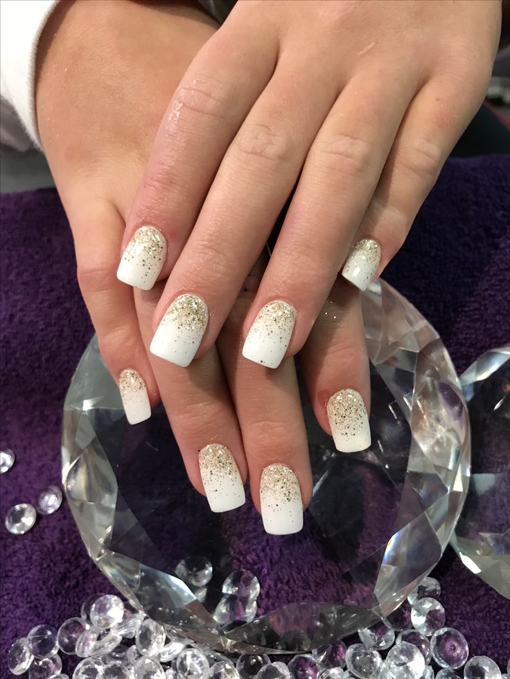 Sophisticated Ombre Nail Design with White to Gold Sparkle Transition.