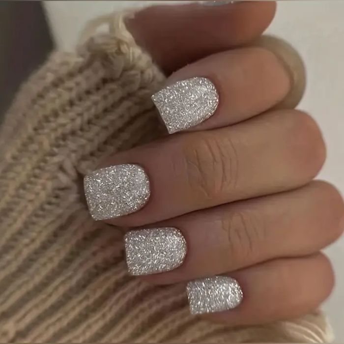 Glamorous Sparkly Nail Design with Shimmering Finish for Elegant Occasions