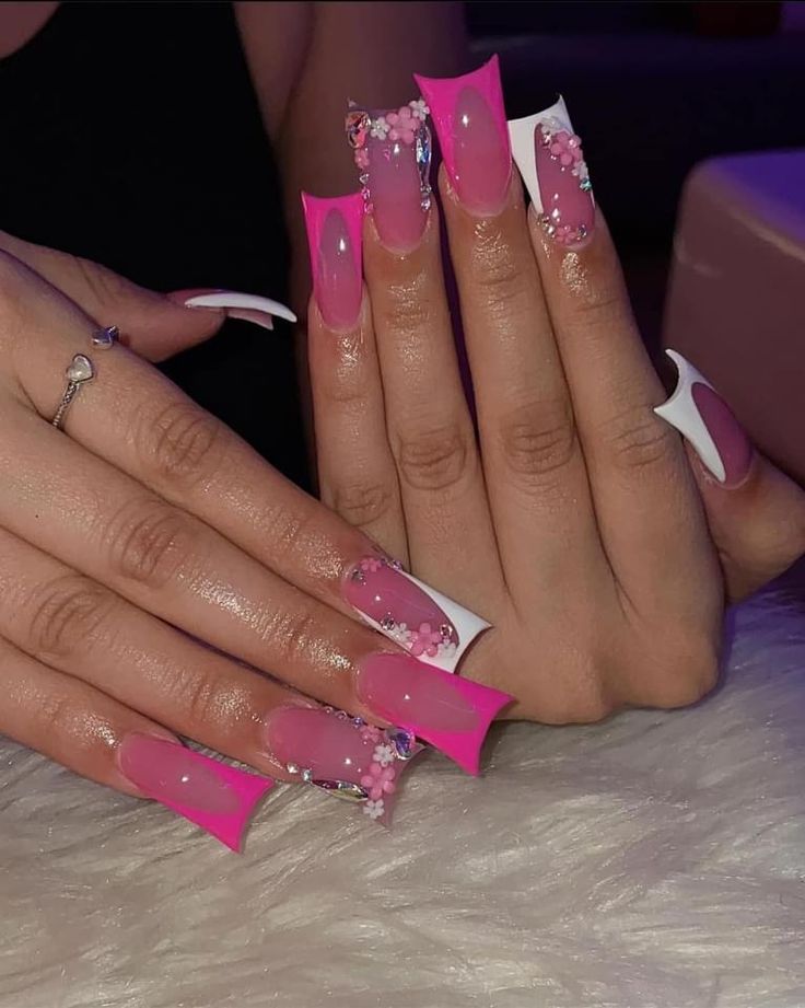 Vibrant Pink Long Nail Design with Floral Accents and Glossy Finish for Bold Glamour.