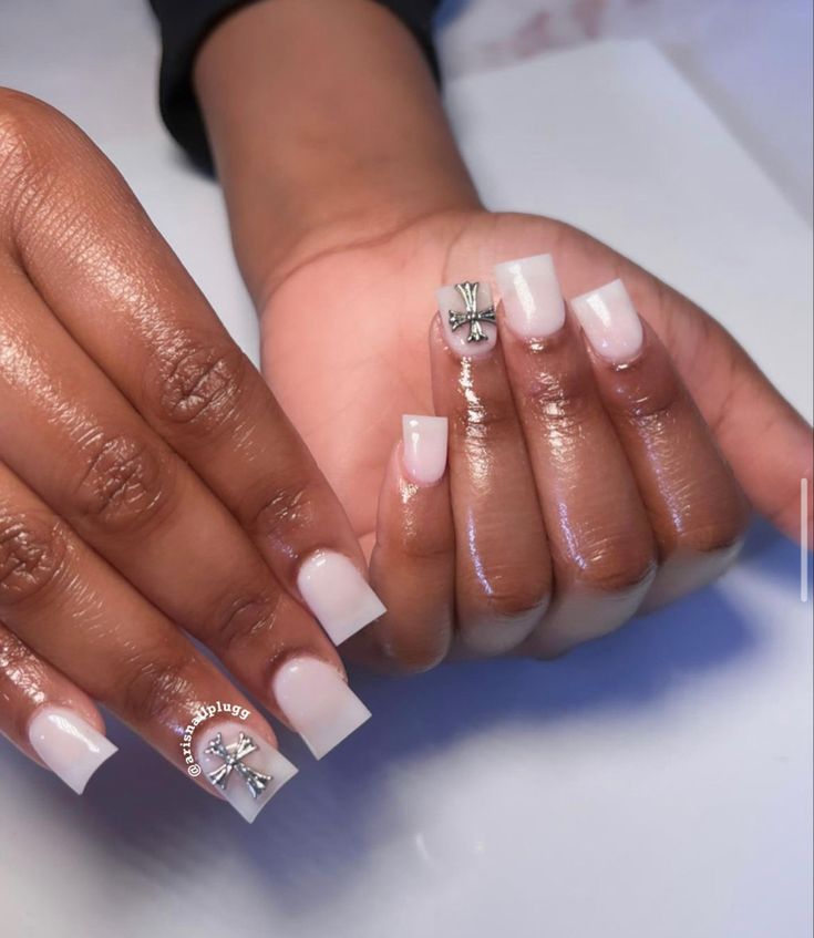 Chic French Tip Nail Design with Subtle Embellishments for Elegant Occasions.