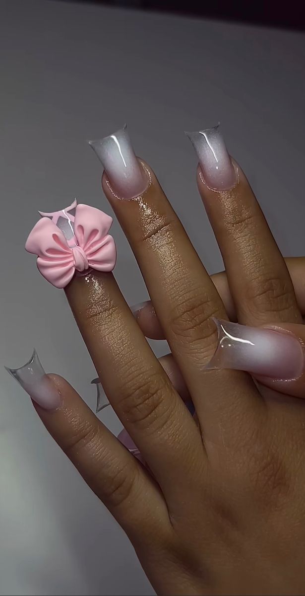 Chic Ombre Nail Design with Pink Bow Accent