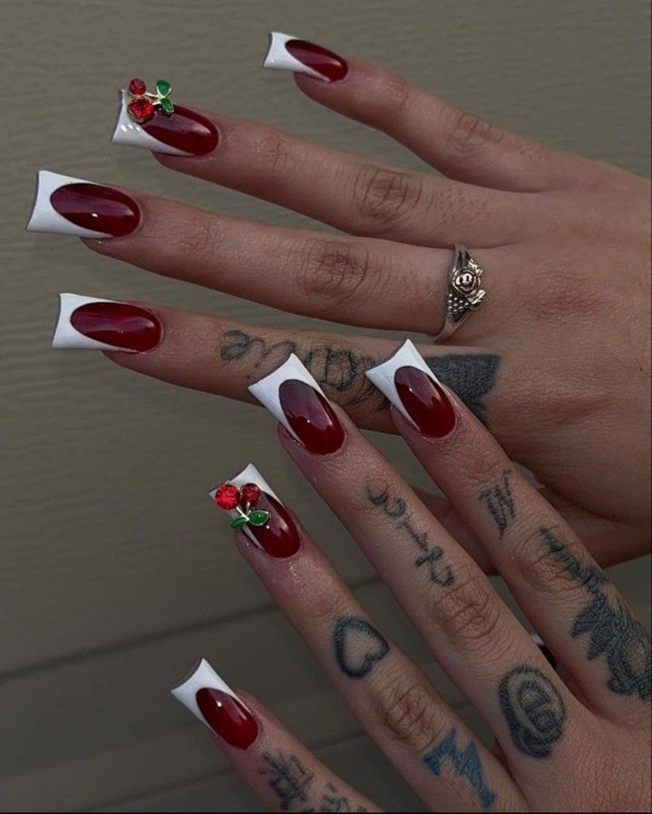 Chic Red and White Nail Design with Floral Accents for a Stylish Aesthetic.