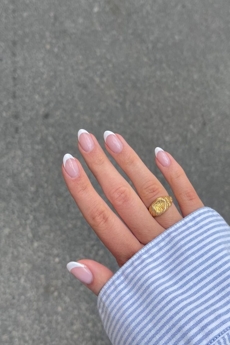 Sophisticated Minimalist French Manicure with Gold Accent.