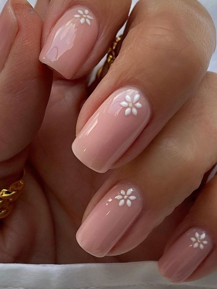 Elegant Pastel Nail Design with Peach Hues and Minimalist Floral Accents.