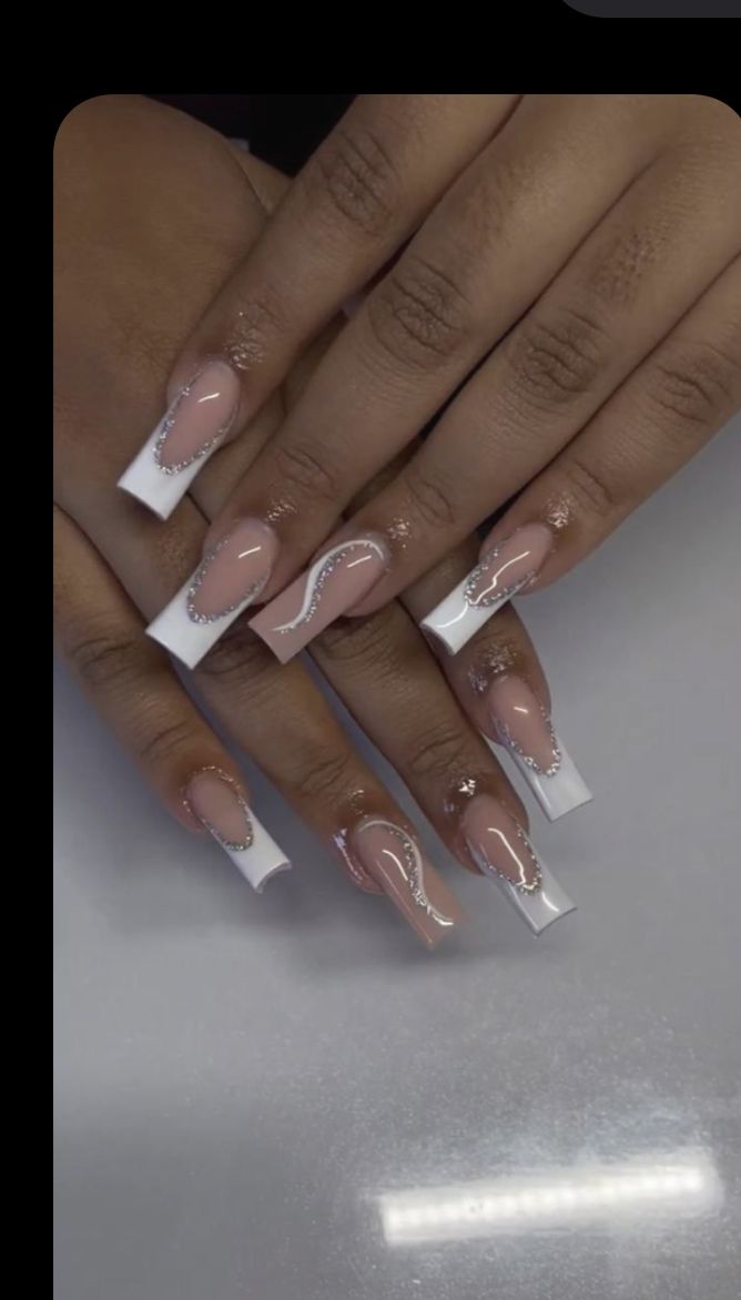 Sophisticated Long Squared Nails in Soft Pink with Glamorous White Tips and Shimmering Accents.