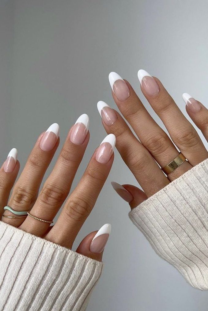 Sophisticated French Manicure with Modern Twist and Elegant Almond Shape.