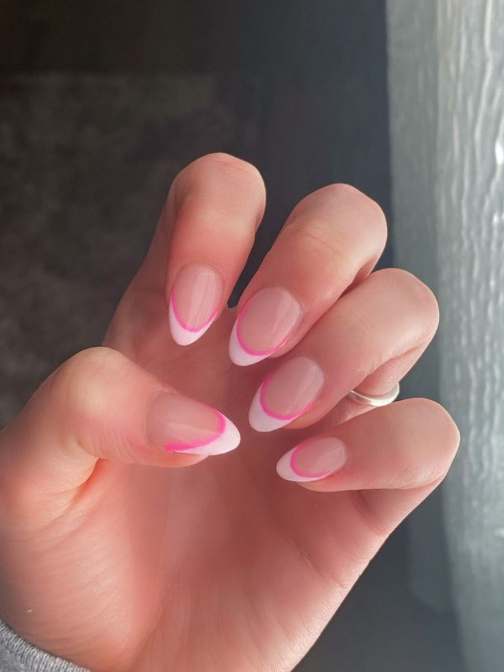 Modern French Manicure: Elegant Almond Nails with Vibrant Pink Accents.