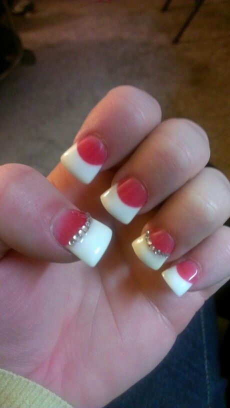 Chic French Tips with Vibrant Pink Accents and Dazzling Rhinestones.