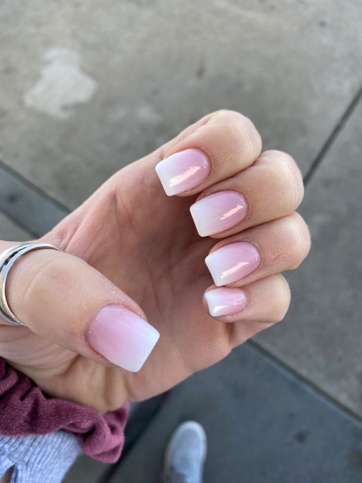 Sophisticated Elegant Ombre Nails: A Versatile Light Pink to White Gradient Design.