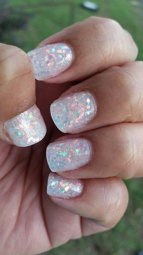 Captivating Sparkling Nail Design with Translucent Base and Iridescent Glitter