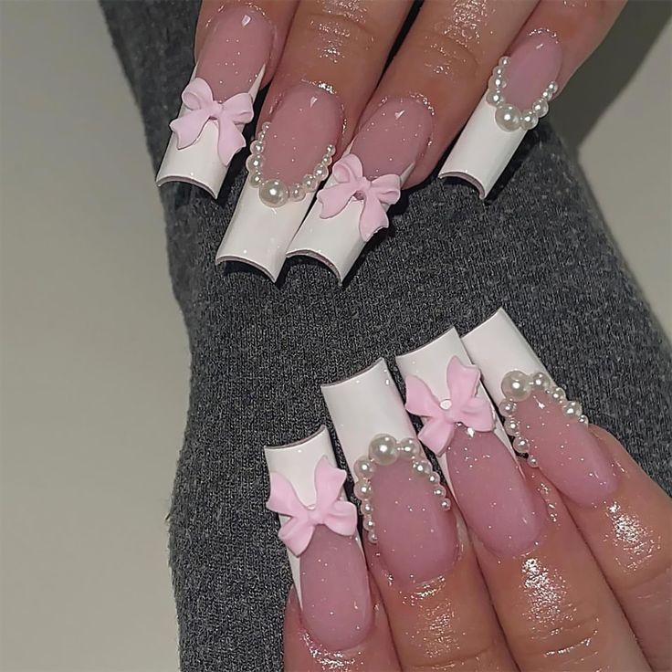 Chic Pink-Tinted Acrylic Nails with White Tips and Pearl-Embellished Bows