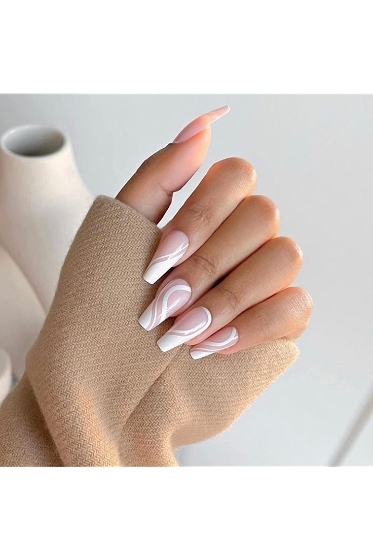 Chic Almond-Shaped Nail Design: Soft Pink and Classic White with Elegant Negative Space Accents