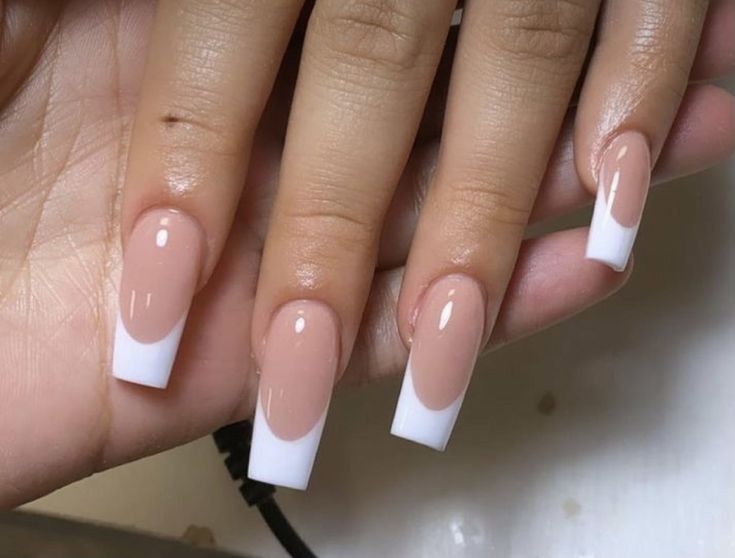 Chic and Sophisticated French Tip Nail Design with Bold White Accents.