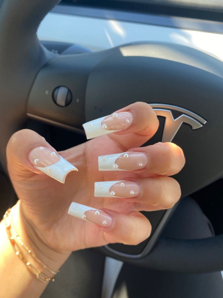 Chic French Manicure with Playful Bubbly Accents on Long Square Tips.