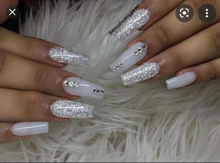 Elegant Glossy White and Glitter Nail Design for Special Occasions.