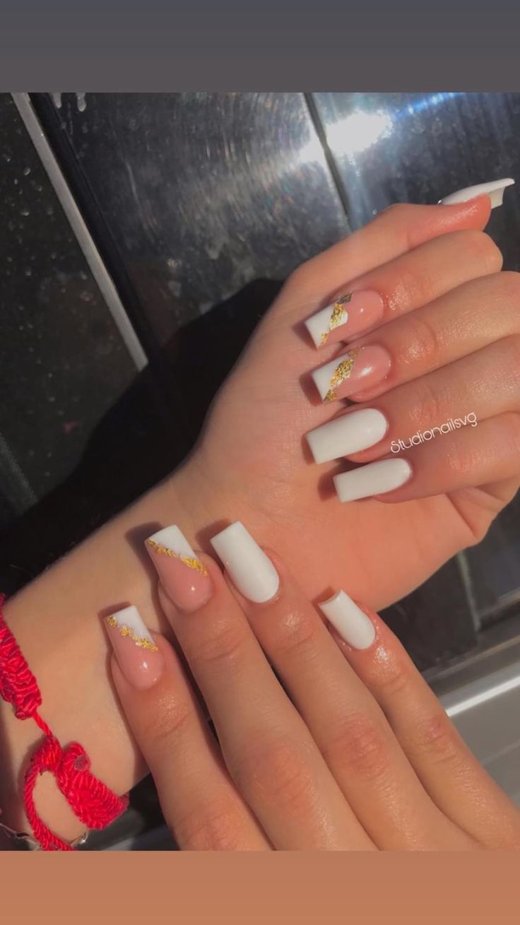 Chic Nail Design: Soft Nude and Striking White with Glamorous Gold Accents