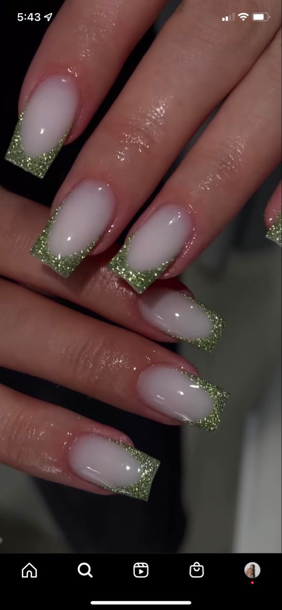 Chic Ombre Nail Design: Elegant White to Sparkling Green Glitter Transition