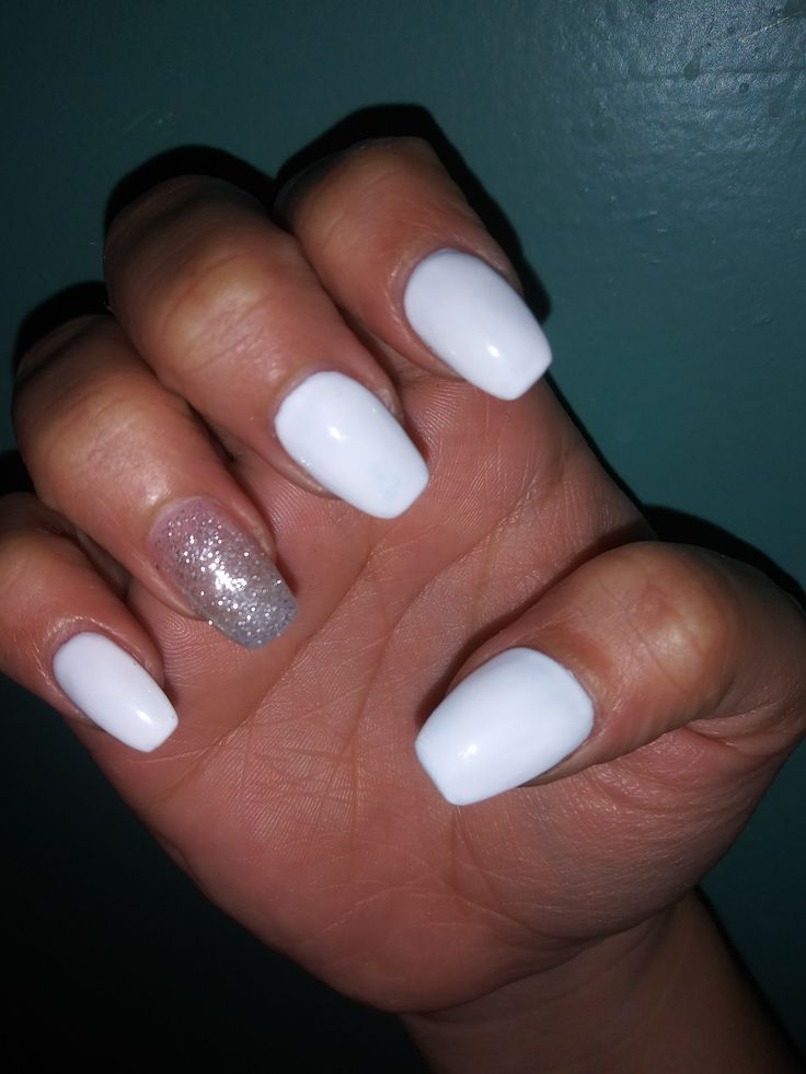 Chic White Manicure with Glamorous Silver Glitter Accent Nail.