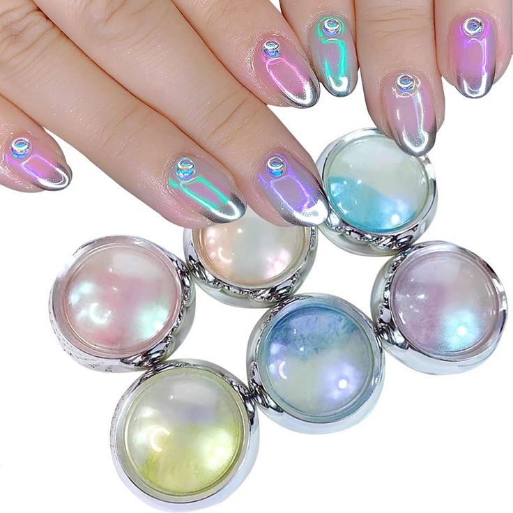 Stunning Iridescent Nail Design with Gem Accents for a Trendy, Futuristic Look.