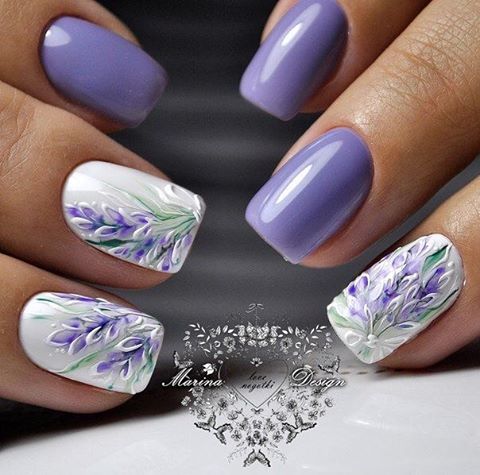 Elegant Lavender Floral Nail Design: Hand-Painted Artistry on Glossy White Base.