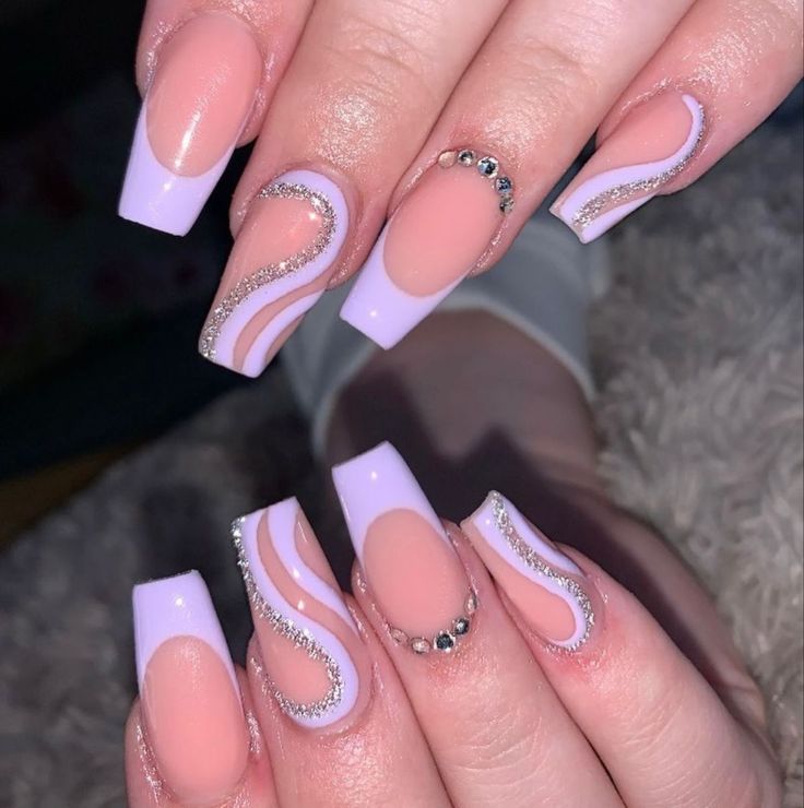 Chic Lavender and Nude Nail Design with Wavy Patterns and Rhinestones.