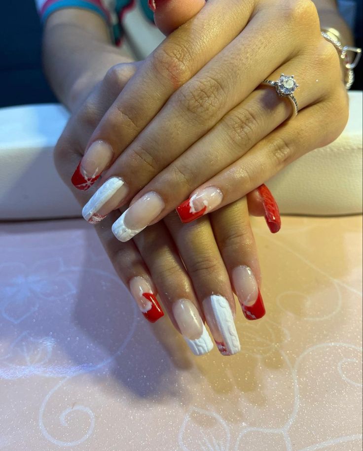 Bold Red and White Nail Design with Textured Accents for a Modern Statement Look.