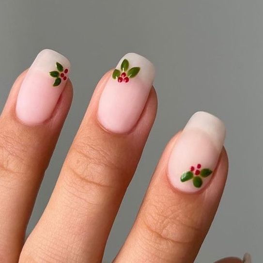 Charming Floral-Inspired Soft Pink Nail Design with Whimsical Accents.