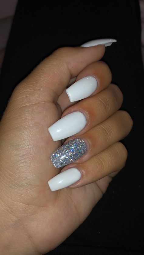 Chic White Manicure with Glamorous Holographic Accent Nail.