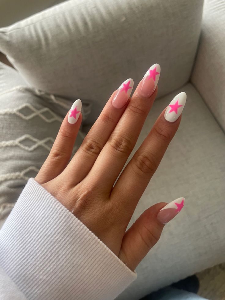 Trendy Almond-Shaped Nails with Playful Pink and White Design Accented by Bold Stars