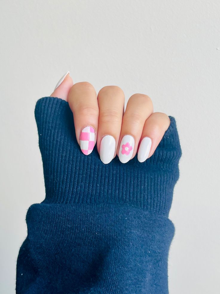 Modern Chic Nail Design: Pastel Colors and Playful Patterns on a Soft Gray Base.