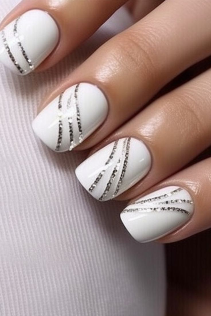 Chic White Base Nail Design with Delicate Silver Glitter Stripes