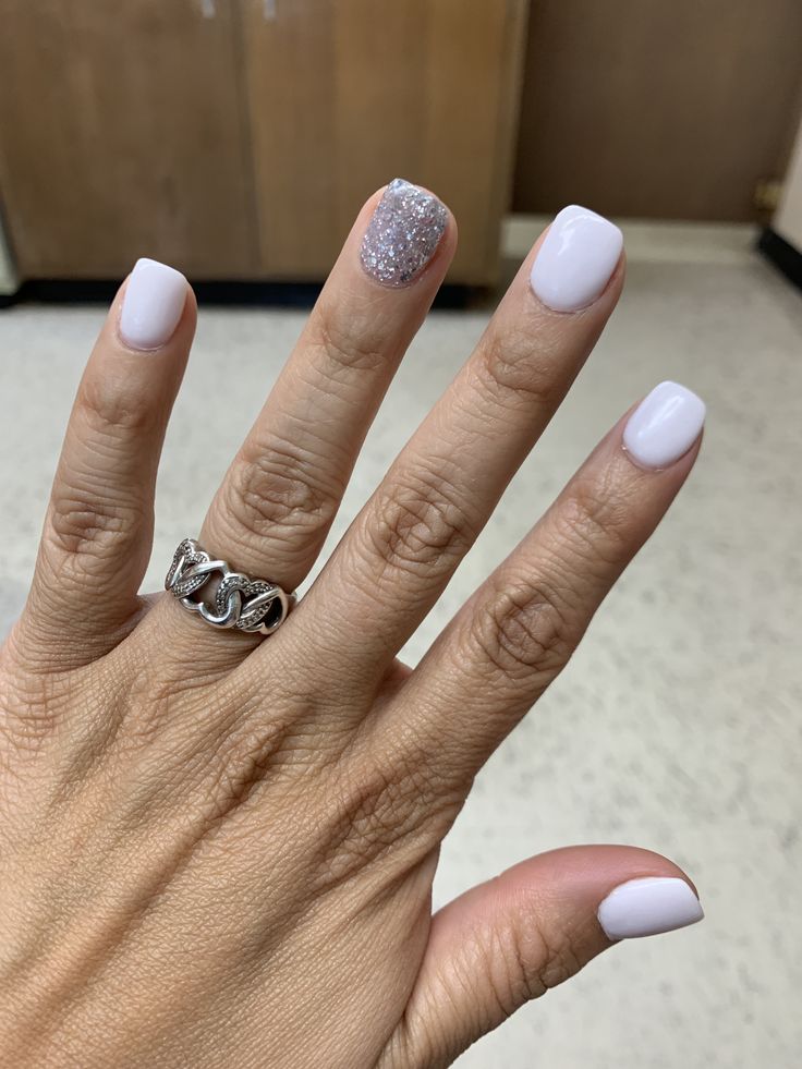 Sophisticated Soft Pastel Lavender Manicure with Sparkling Silver Glitter Accent.