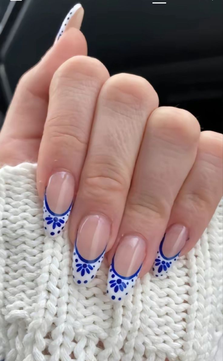 Sophisticated French Tip Nails with Intricate Blue Floral Designs