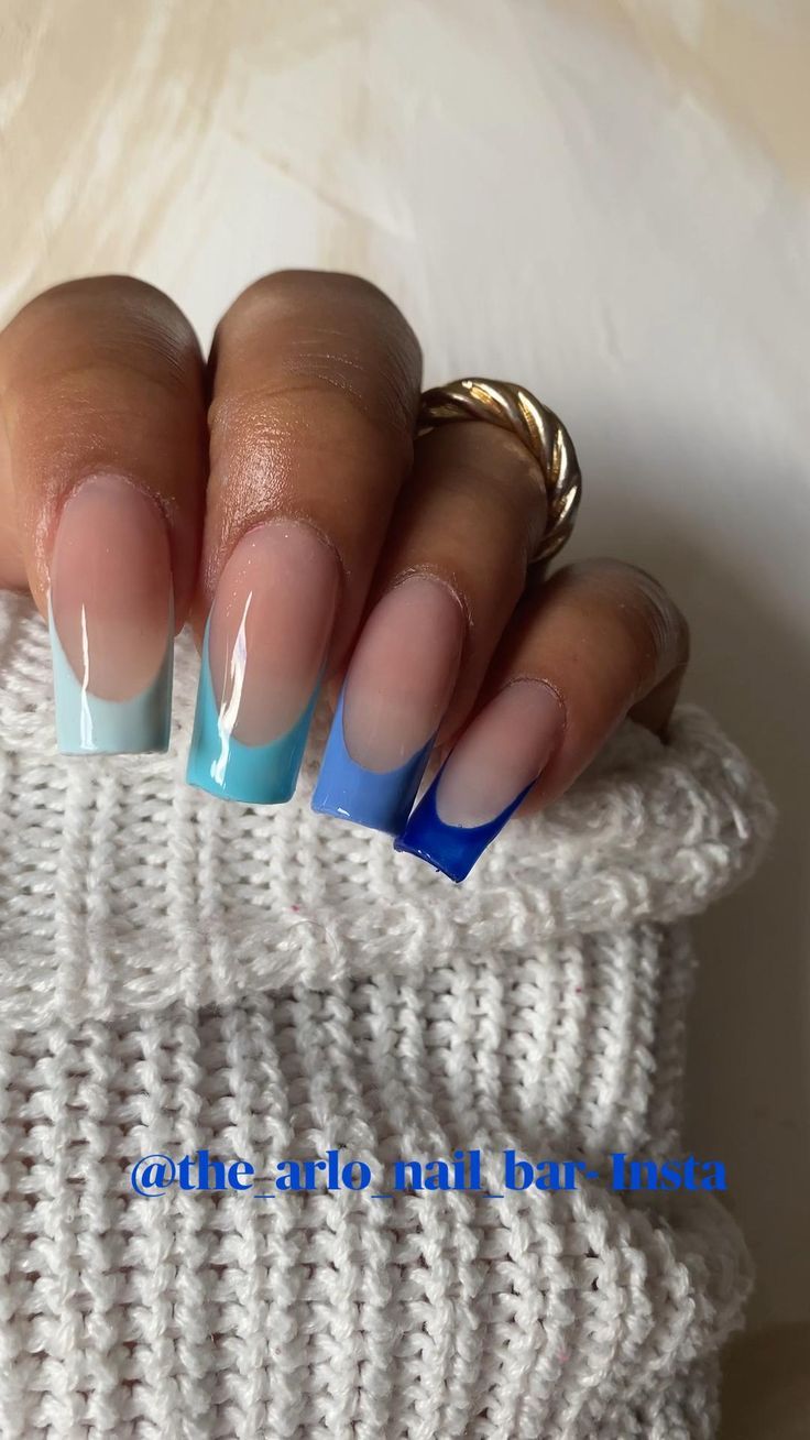 Stylish Ombre Nail Design with Gradient Blue Shades and Elegant Finish.