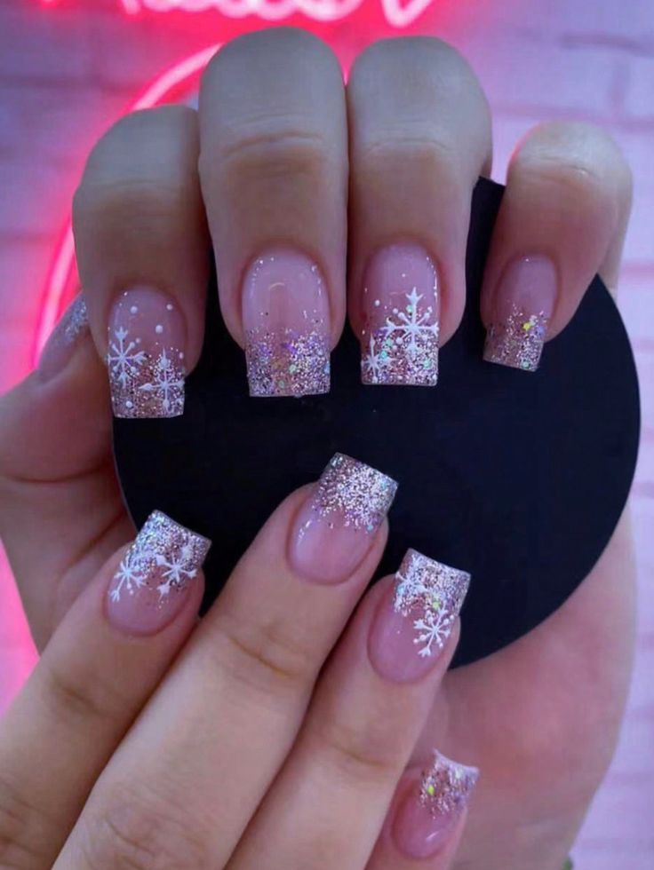 Elegant Winter Ombre Manicure with Frosted Tips and Snowflake Designs for Holiday Glamour