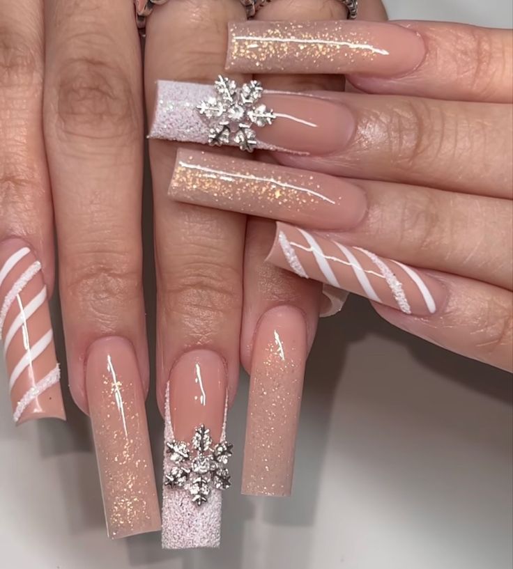 Chic Nude Nail Design with Sparkling Accents and Glamorous Rhinestone Embellishments.