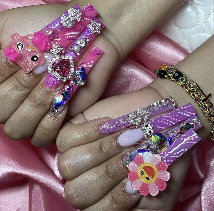 Playful Pink Nail Designs with Whimsical Embellishments for a Trendy Statement.