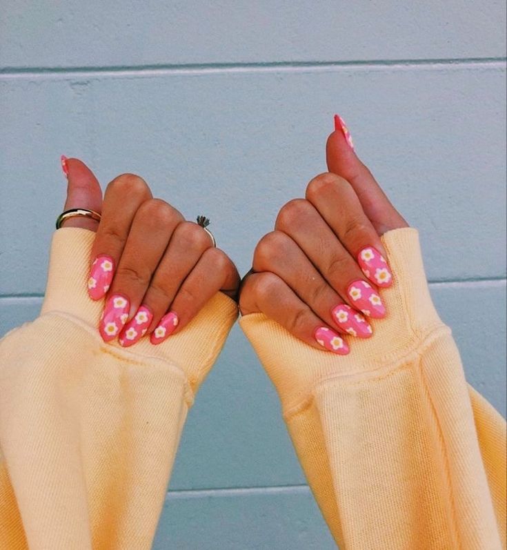 Playful Pastel Pink Floral Nail Design for a Casual Day Out.