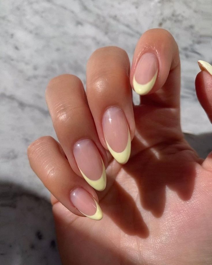 Chic Pastel Yellow Tips on Elegant Clear Base Nail Design