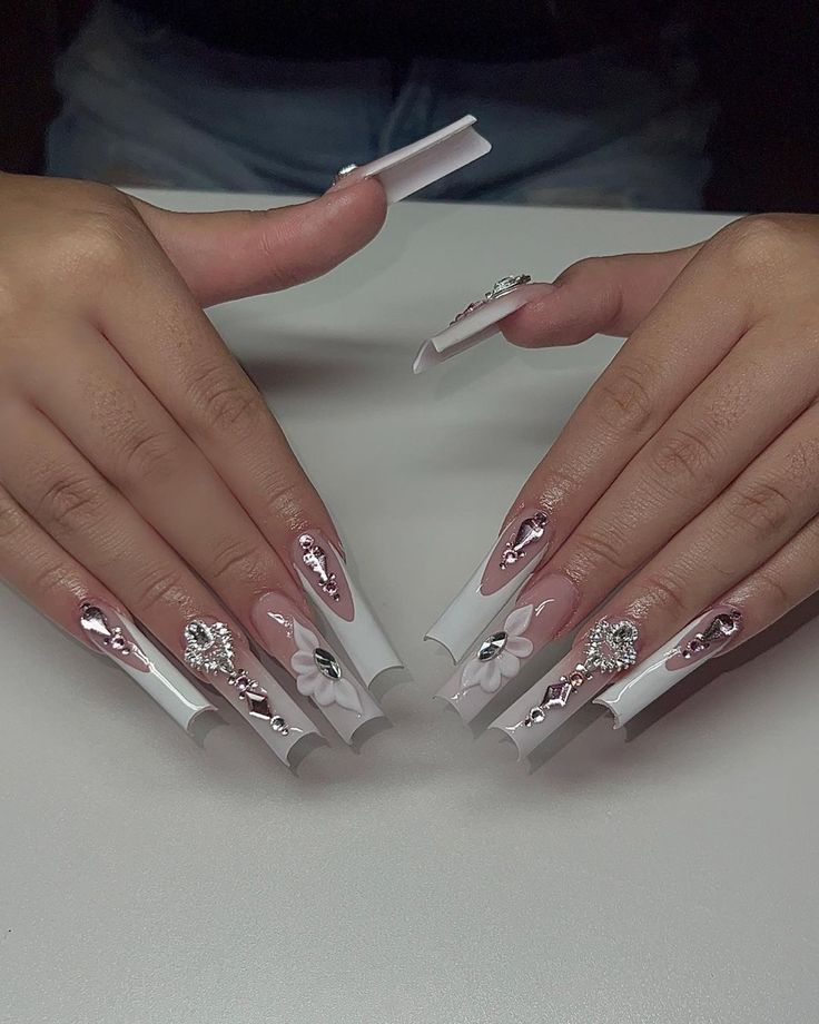 Sophisticated Glamour: Elegant Long White Nail Design with Floral Patterns and Rhinestones